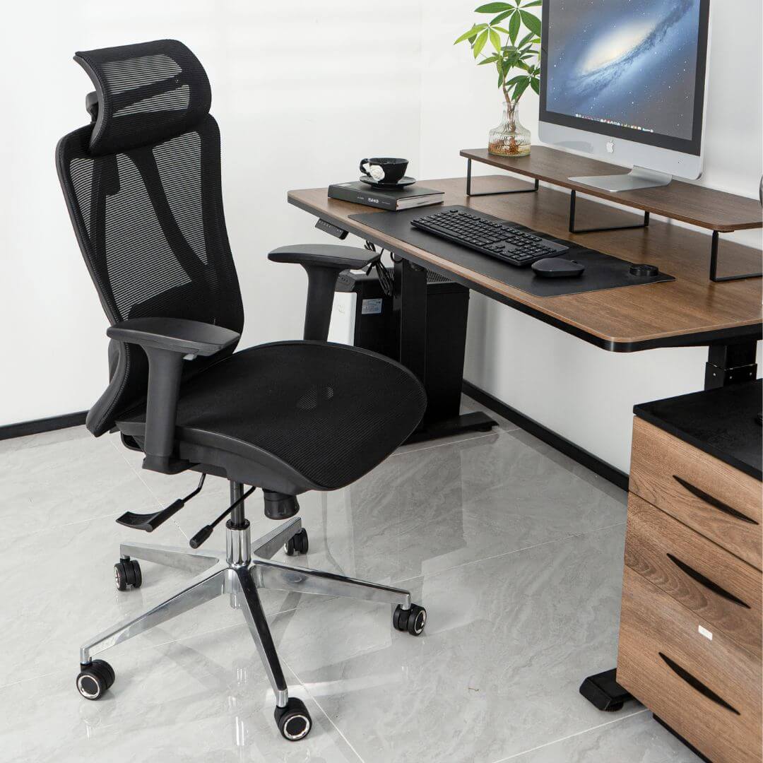Picture showing a workspace setup with a black mesh ergonomic chair